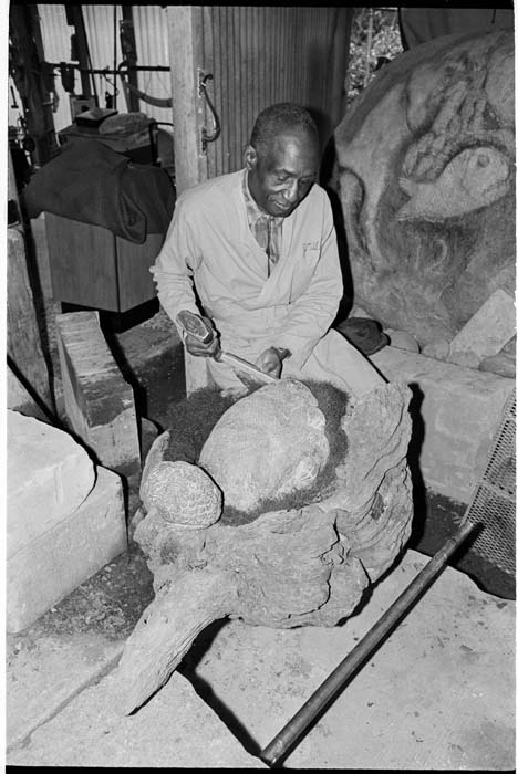 Image of James Washington Jr. carving sculpture 