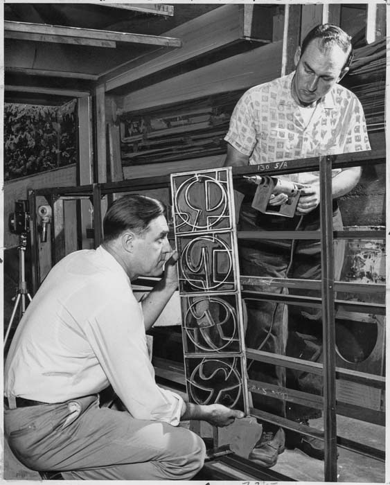 Image of Glen Alps & Edwin Essex with model for City Hall fountain, Seattle, September 1961