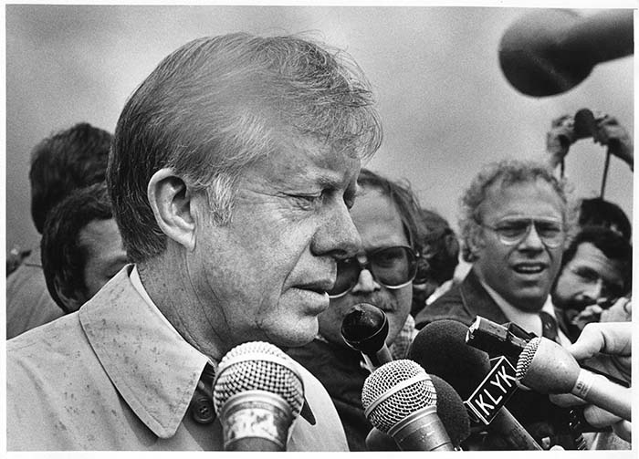 Image of Jimmy Carter speaking to media after viewing Mt. St. Helens eruption zone, Kelso, May 22, 1980