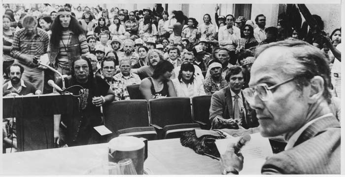 Image of Slade Gorton listening to testimony on bill to decommercialize steelhead trout, Seattle, June 29, 1981