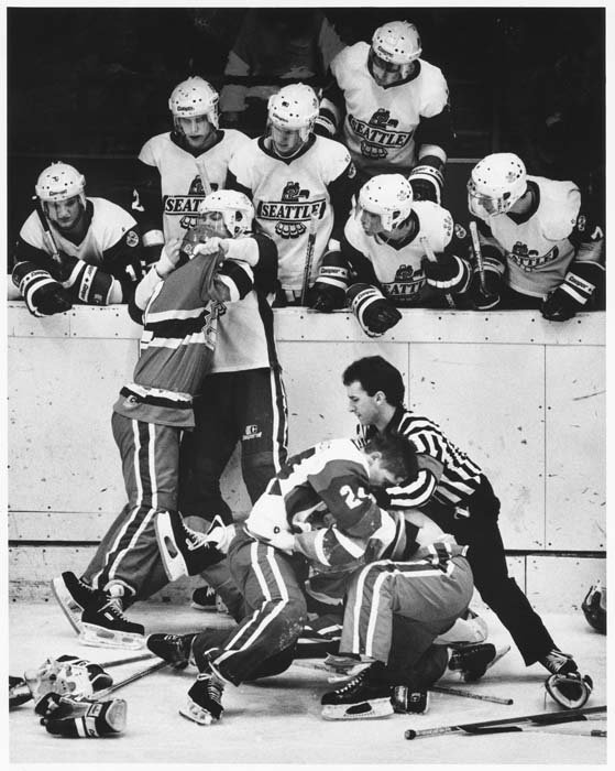 Image of Seattle Thunderbirds and Spokane Chiefs hockey players brawling, Seattle, December 21, 1986
