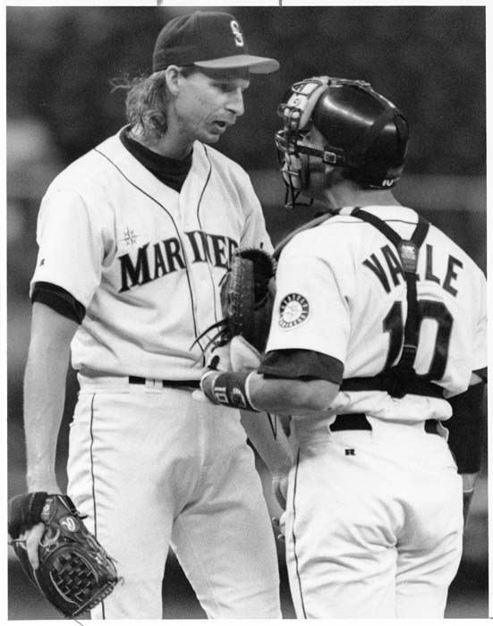 Image of Randy Johnson and Dave Valle talking at pitcher's mound, May 26, 1993