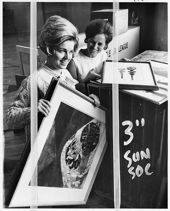 Image of Two Seattle Junior League members with art works, Seattle, April 1971