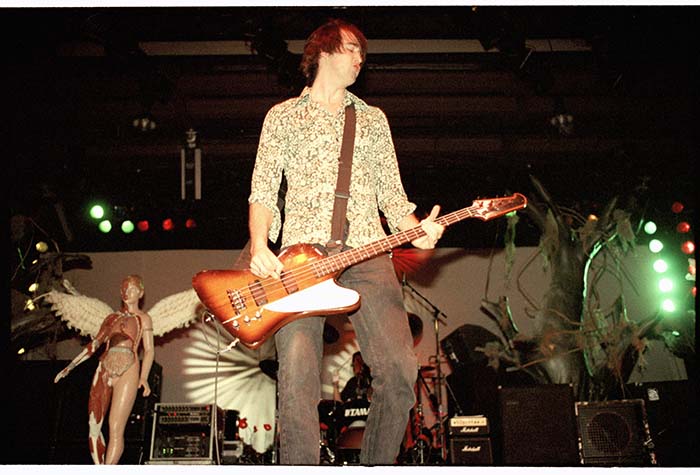 Image of Krist Novoselic on stage during Nirvana concert, Seattle Center Arena, January 7, 1994