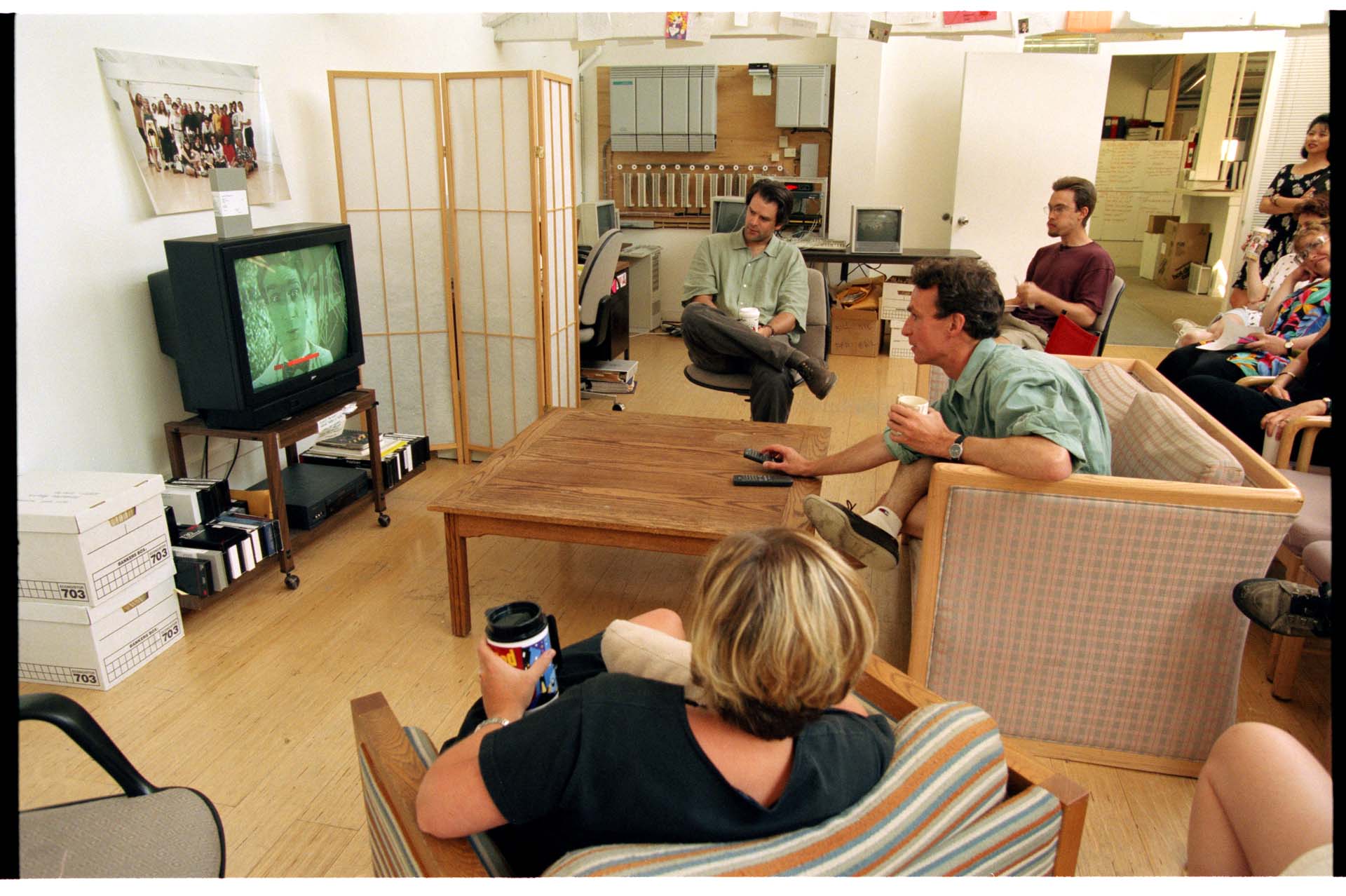 Image of Bill Nye with others watching an episode of his show, Seattle, July 15, 1996