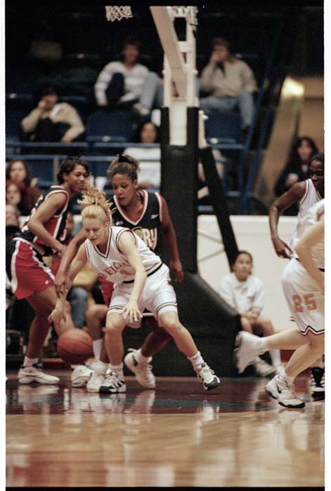 Image of Andrea Nagy stealing ball during Seattle Reign basketball game, Seattle, December 12, 1996