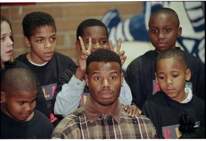 Image of Ken Griffey, Jr. with children at Rainier Vista Boys & Girls Club, Seattle,  December 16, 1996