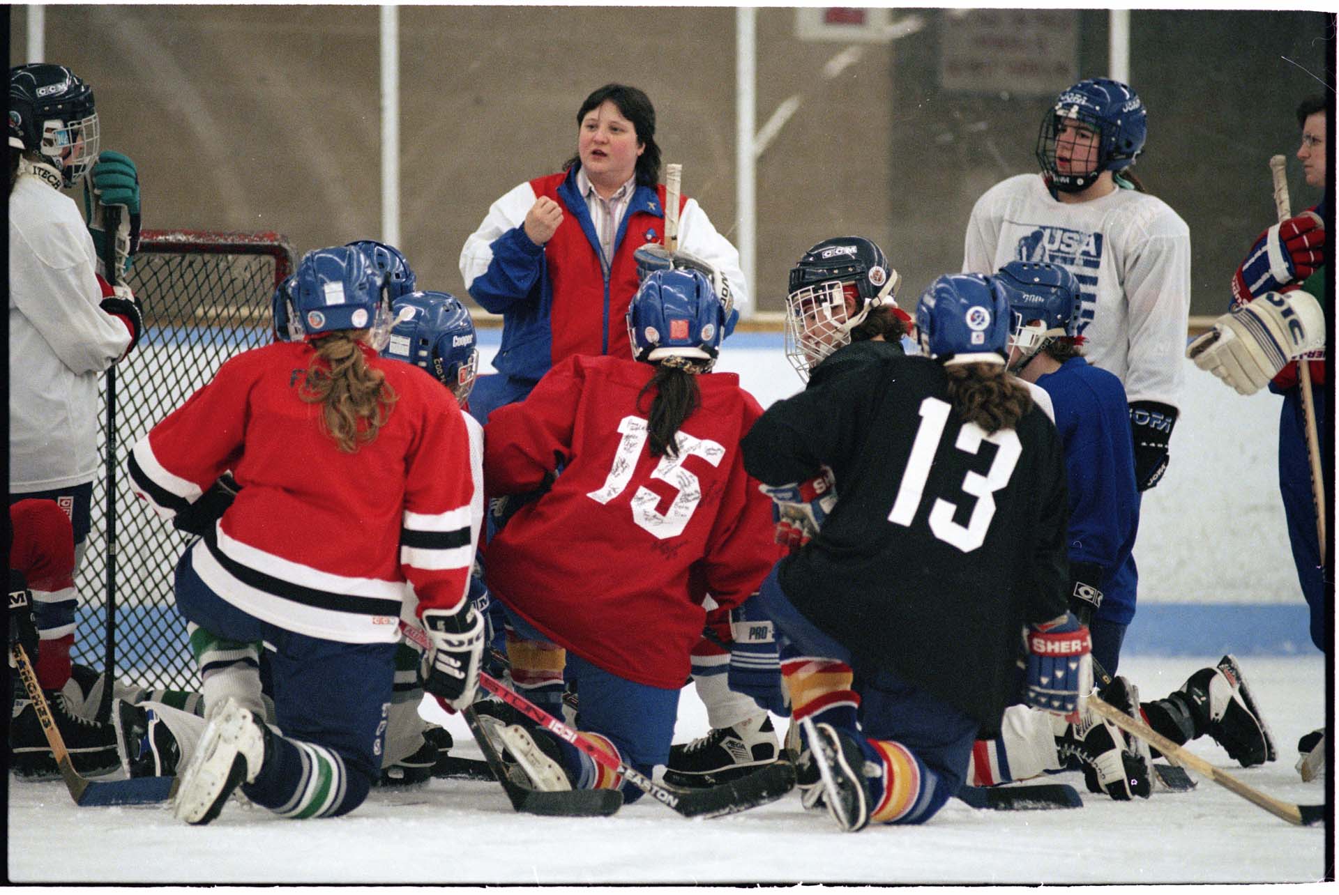Image of Northwest Admirals coach Cindy Dayley talks with hockey team at practice in Olympic View Arena, March 1997