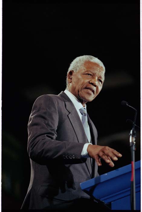 Image of Nelson Mandela speaking at welcoming ceremony at Boeing Field, Seattle, December 8, 1999