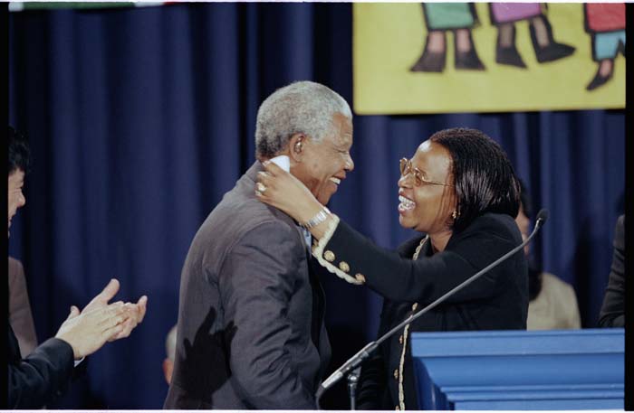 Image of Nelson Mandela and Graça Machel at welcoming ceremony at Boeing Field, Seattle, December 8, 1999