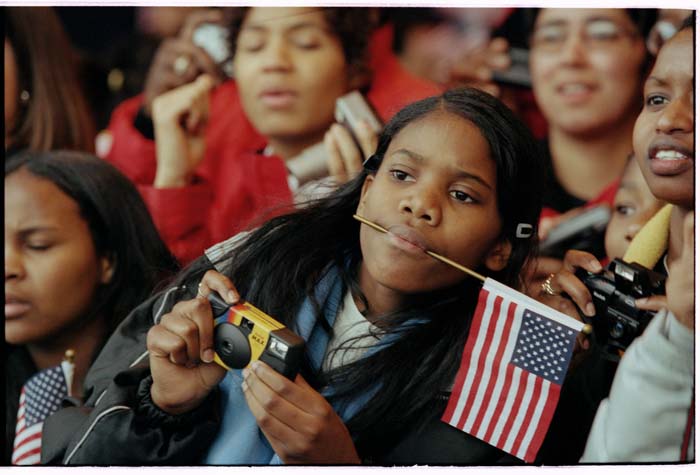 Image of Shyidah Salahud'din trying to take a picture at Nelson Mandela welcoming ceremony, December 8, 1999