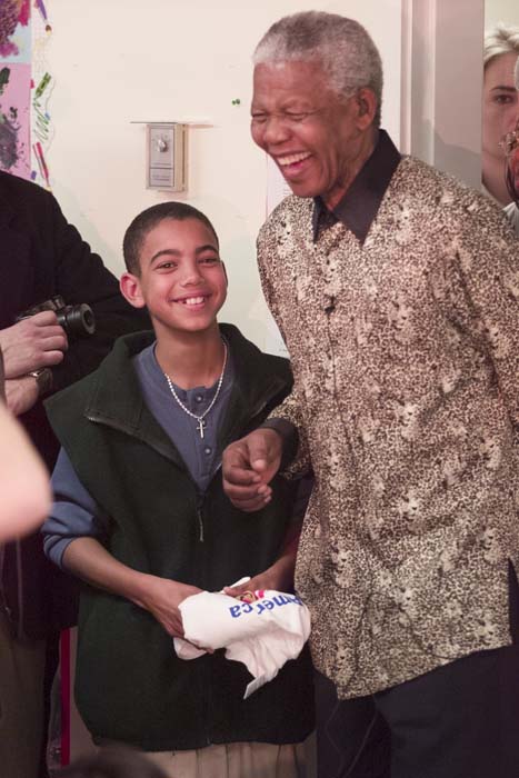 Image of Nelson Mandela with student Denis Leclech, Seattle, December 8, 1999