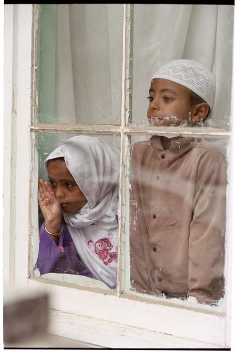 Image of Two children in the window of the Masjid Al-Salaam, SeaTac, August 3, 2001