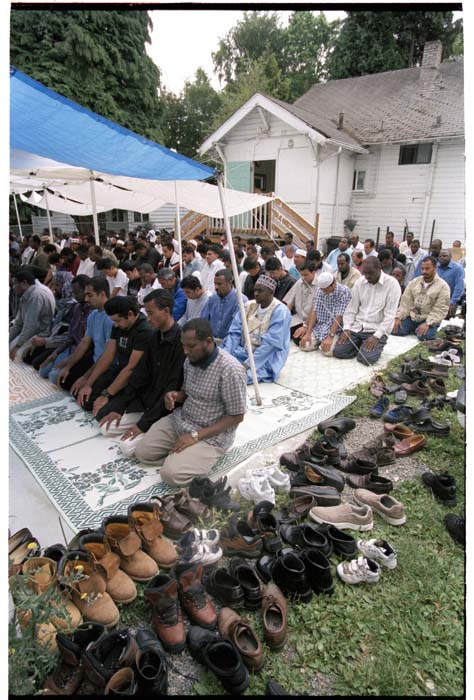 Image of Men sitting during worship at the Masjid Al-Salaam, SeaTac, August 3, 2001