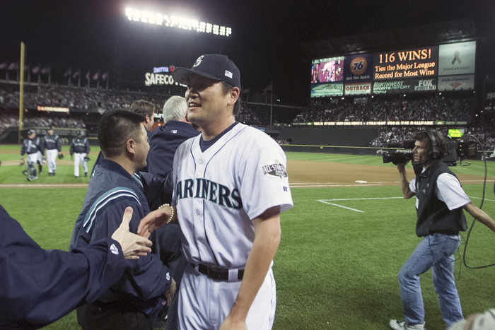 Image of Mariners pitcher Kazuhiro Sasaki being congratulated after 116th win, Safeco Field, Seattle, October 6, 2001