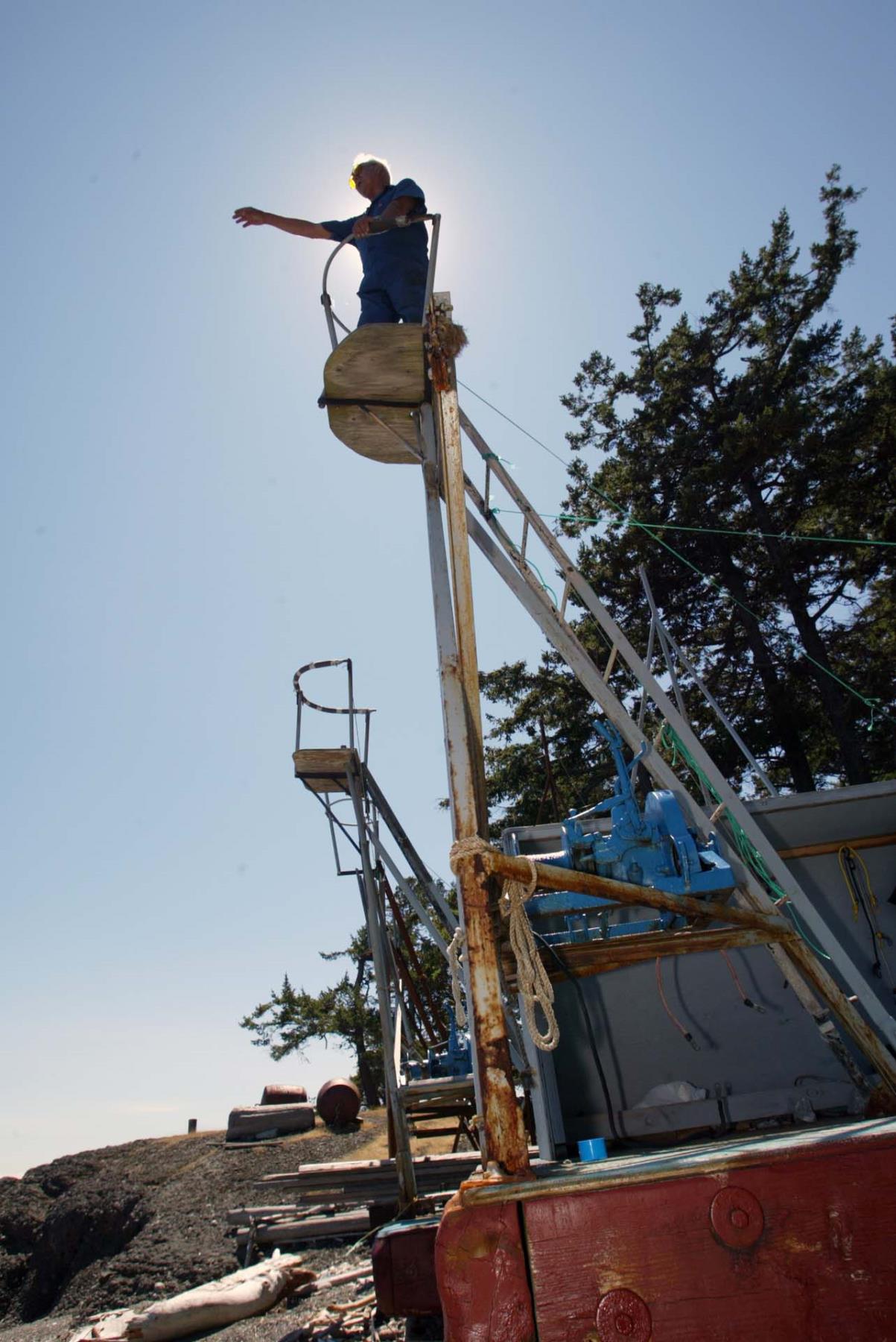 Image of Charles Chevalier looking out from fishing tower, July 21, 2002