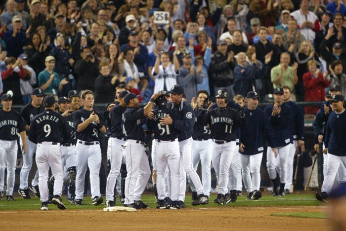 Image of Ichiro Suzuki with teammates after breaking record for most hits in a season, Safeco Field, Seattle, October 1, 2004