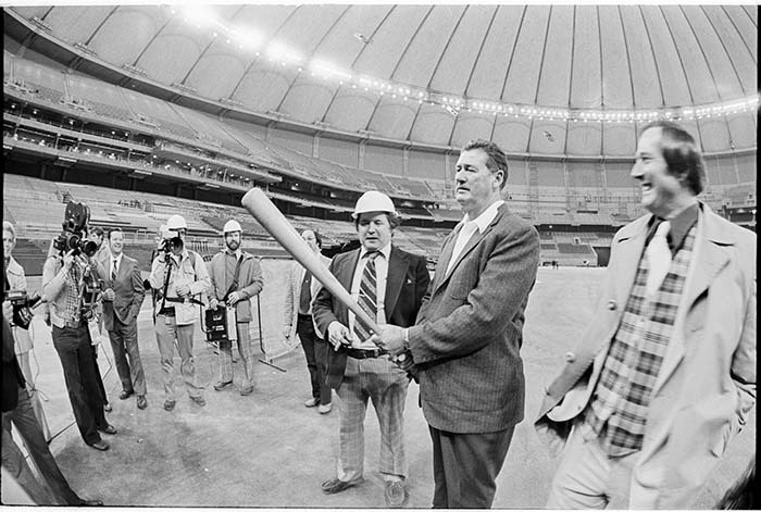 Image of Ted Williams holding bat during tour of the Kingdome, January 1976