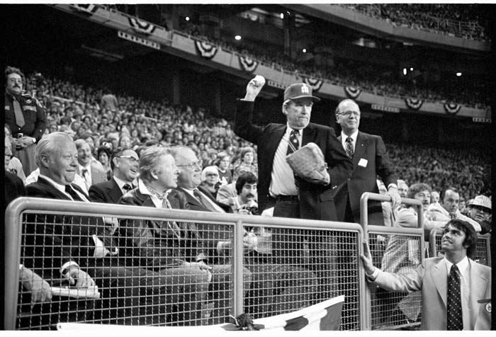 Image of Henry Jackson throwing ceremonial pitch at first Mariners game, April 6, 1977