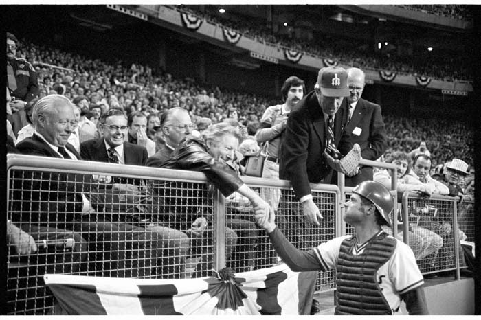 Image of Bob Stinson and Danny Kaye shaking hands at first Mariners game, April 6, 1977