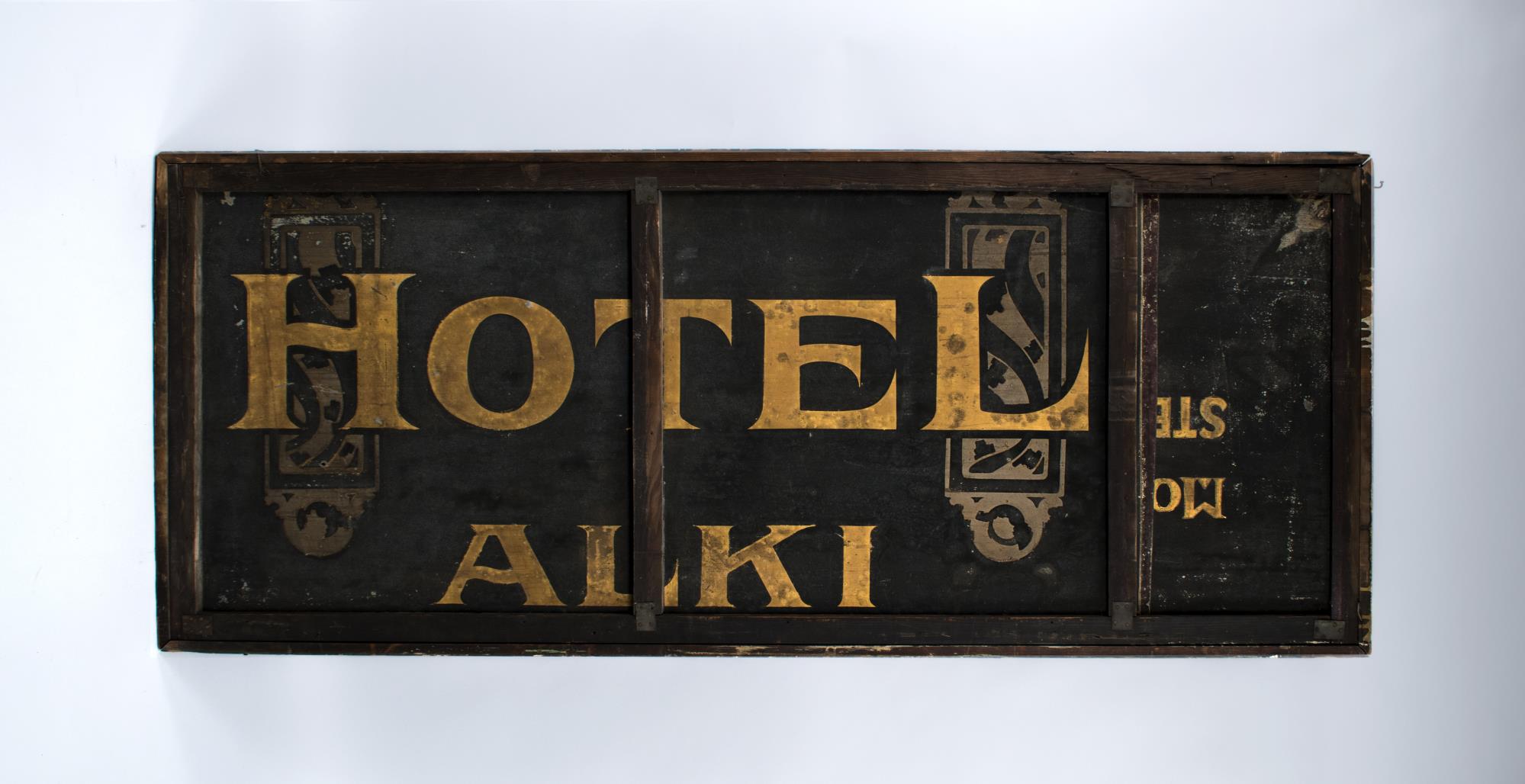 Image of Hotel Alki wooden sign, ca. 1910