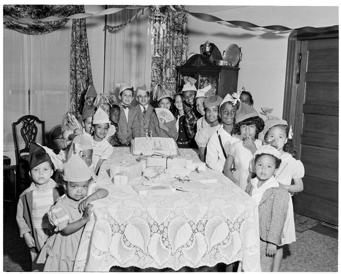 Image of Children around table at birthday party, Seattle, circa 1950