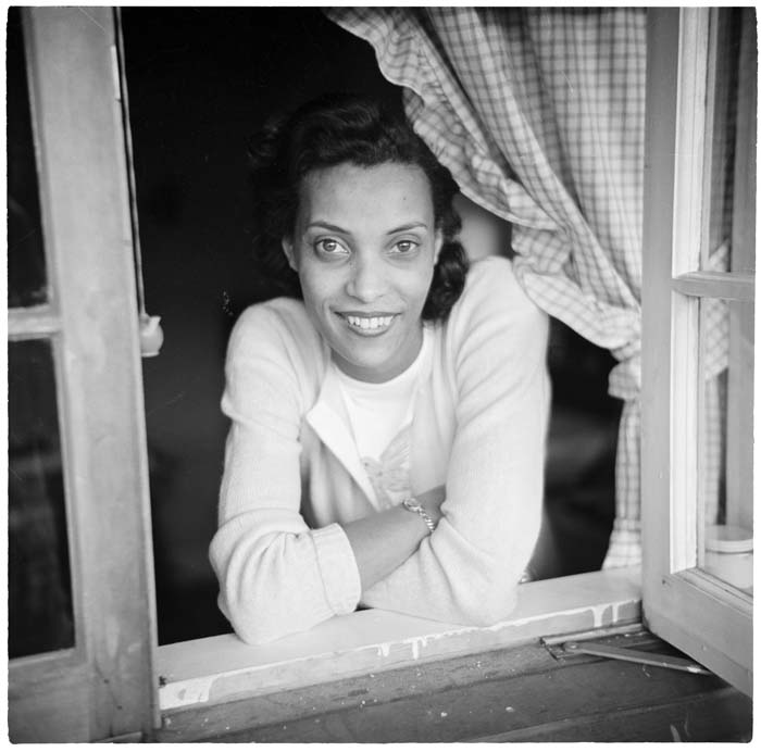 Image of Izzy Smith looking through window, circa 1948