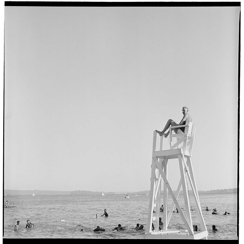 Image of Sonny Norris lifeguarding at Madrona Beach, Seattle, circa 1955