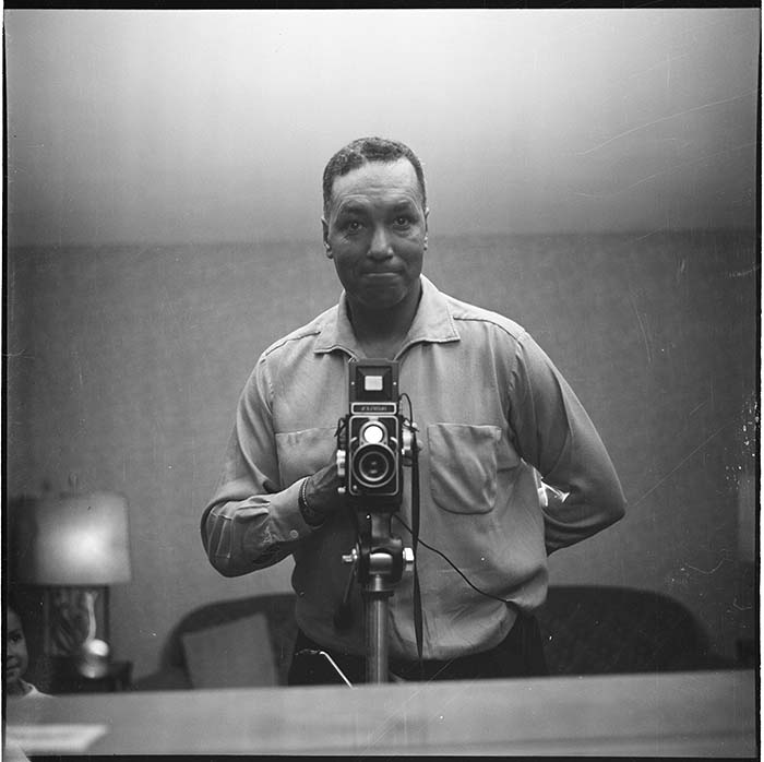 Image of Al Smith taking a self-portrait, Seattle, circa 1953