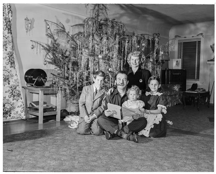 Image of Bob and Lois Hughes family sitting in front of Christmas tree, Seattle, January 1949