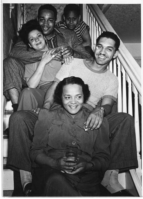 Image of Group sitting on stairs at a party, Seattle, July 16, 1944