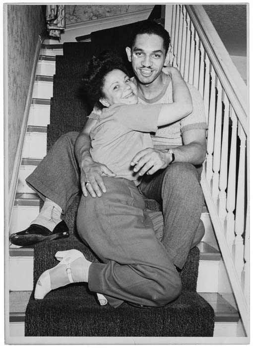 Image of Lester Catlett and woman on stairs at a party, Seattle, July 16, 1944