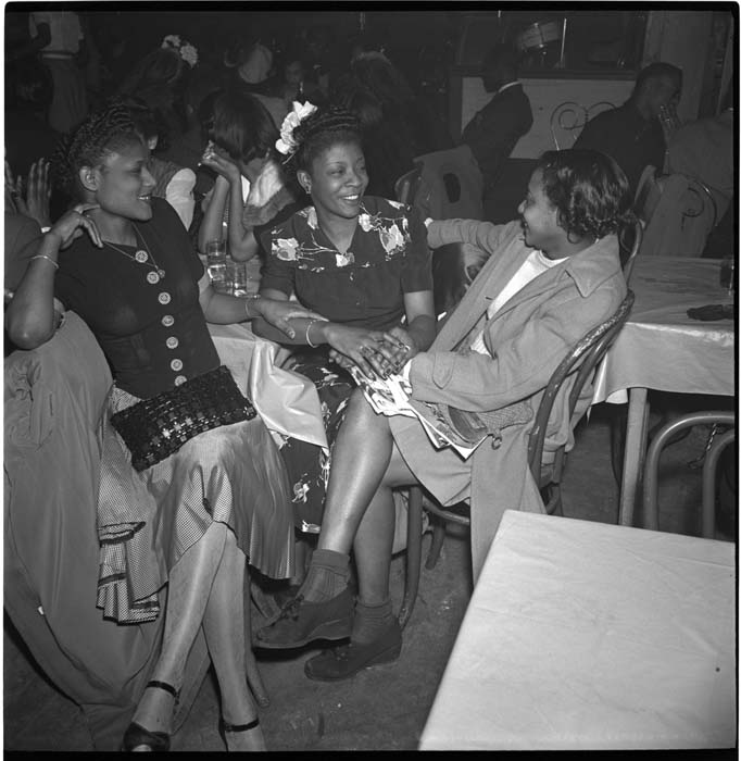 Image of Three women talking at nightclub table, Seattle, circa 1945