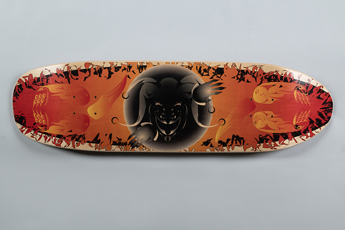 Image of Skateboard deck with Coast Salish designs, made by Tulalip artist Ty Juvinel, ca. 2014