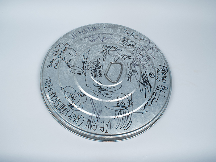 Image of Garbage can lid signed by the members of Queensrÿche, Soundgarden, Pearl Jam, and Alice in Chains, 1992