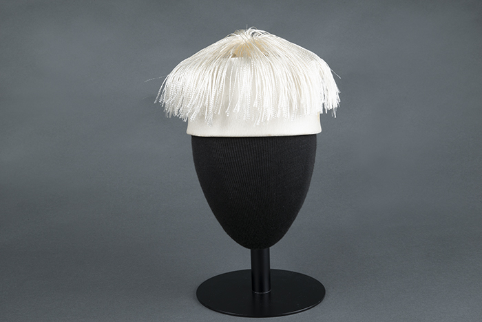 Image of White hat with tassel plume, made by John Eaton, ca. 1950s-1960s