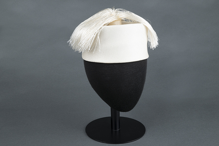 Image of White hat with tassel plume, made by John Eaton, ca. 1950s-1960s