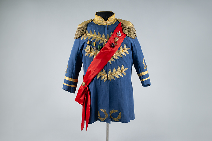 Image of Court uniform with sash and pins, worn by Paul Bigley, ca. 1980s-2010s