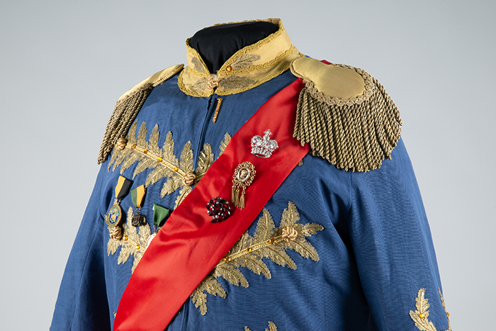 Image of Court uniform with sash and pins, worn by Paul Bigley, ca. 1980s-2010s
