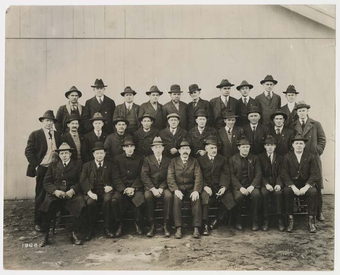 Image of Group of men in suits posed outdoors, circa 1920