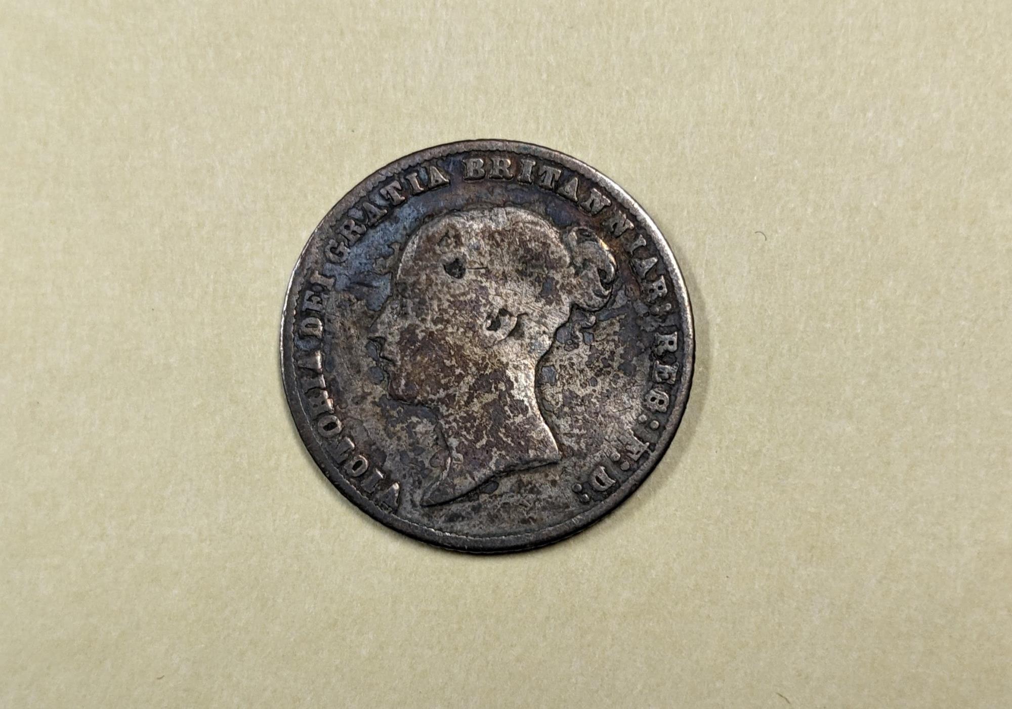 Image of Wallet and coins that once belonged to Morgan James Carkeek, ca. 1866