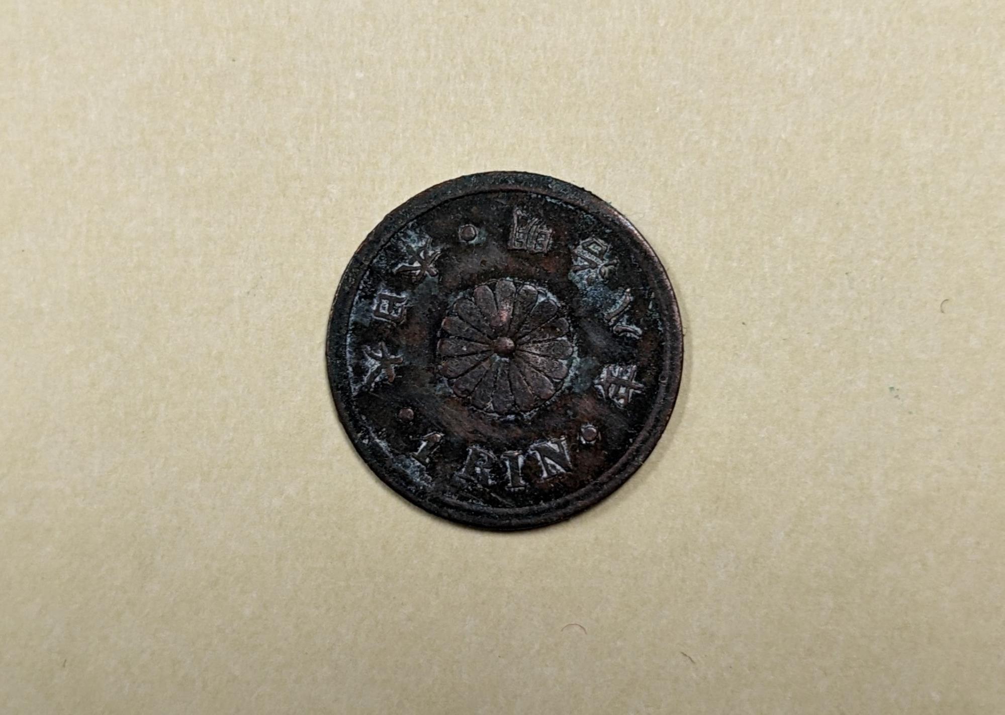 Image of Wallet and coins that once belonged to Morgan James Carkeek, ca. 1866