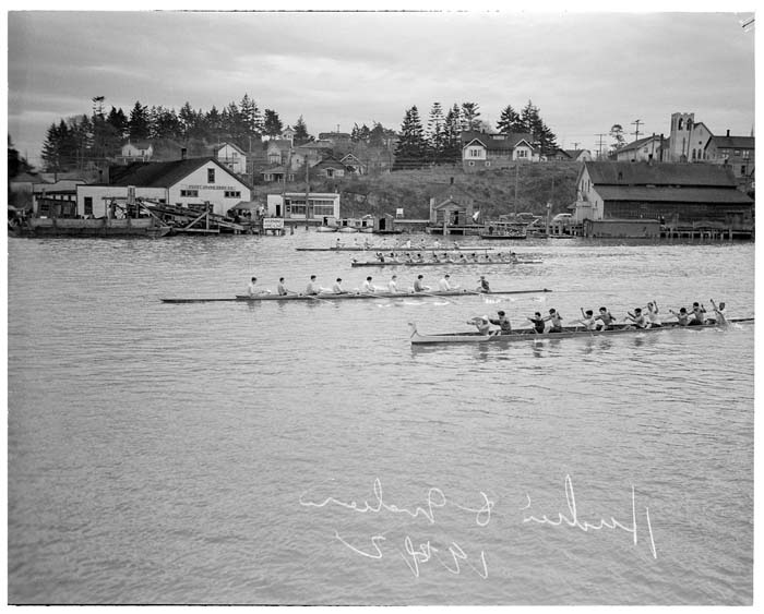 Image of Husky crew and Indigenous canoe race, La Conner, November 29, 1941
