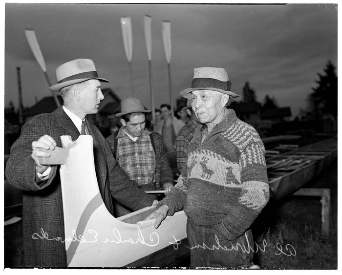 Image of Charlie Edwards and Al Ulbrickson standing by canoe 