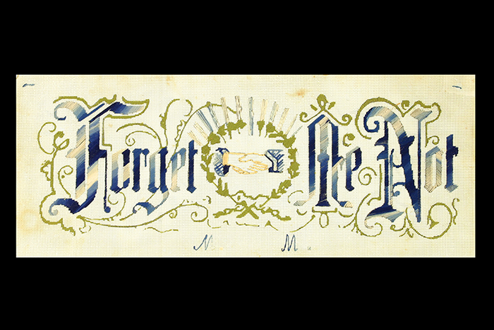 Image of Embroidered motto 