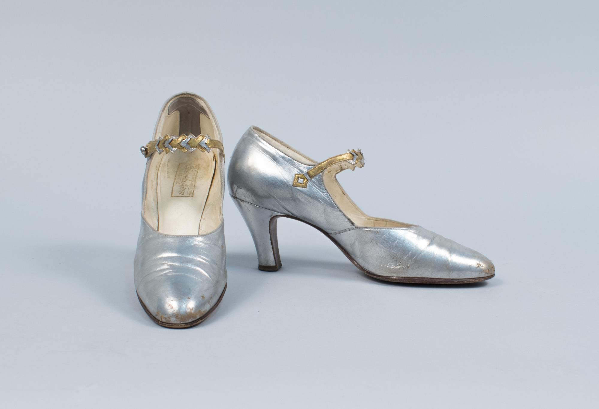 Image of Silver heeled shoes with gold accents, ca. 1920-1925