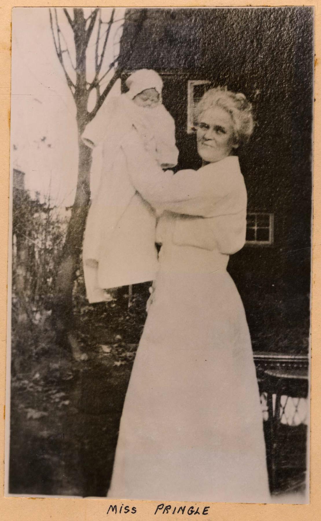 Image of Minor Private Hospital nursing supervisor Lucy I. Pringle holding baby, circa 1925