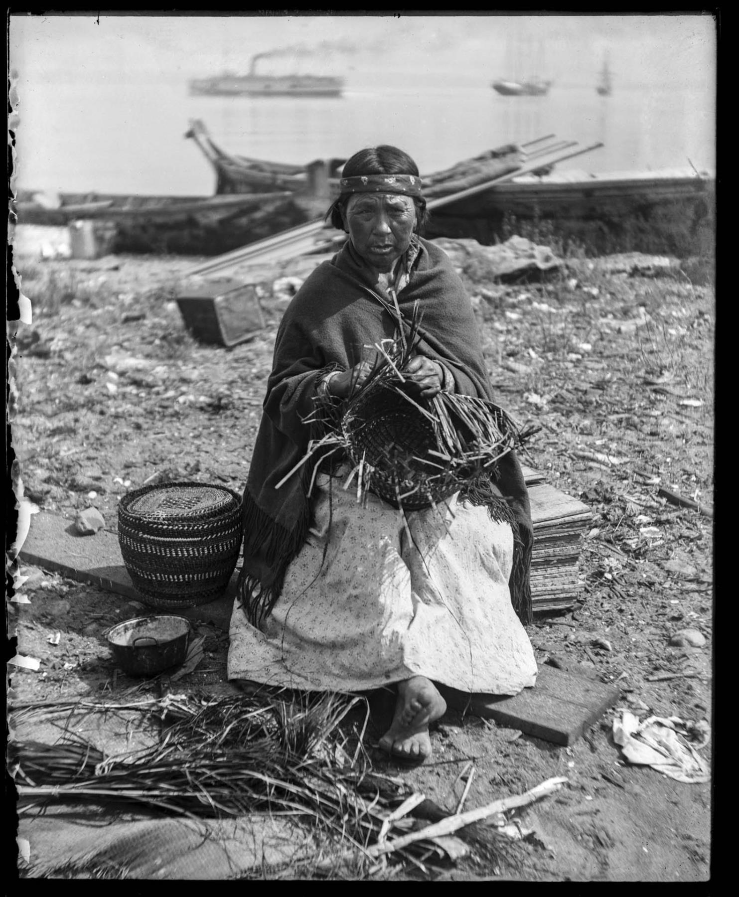 Image of Makah woman making baskets at Neah Bay, circa 1905