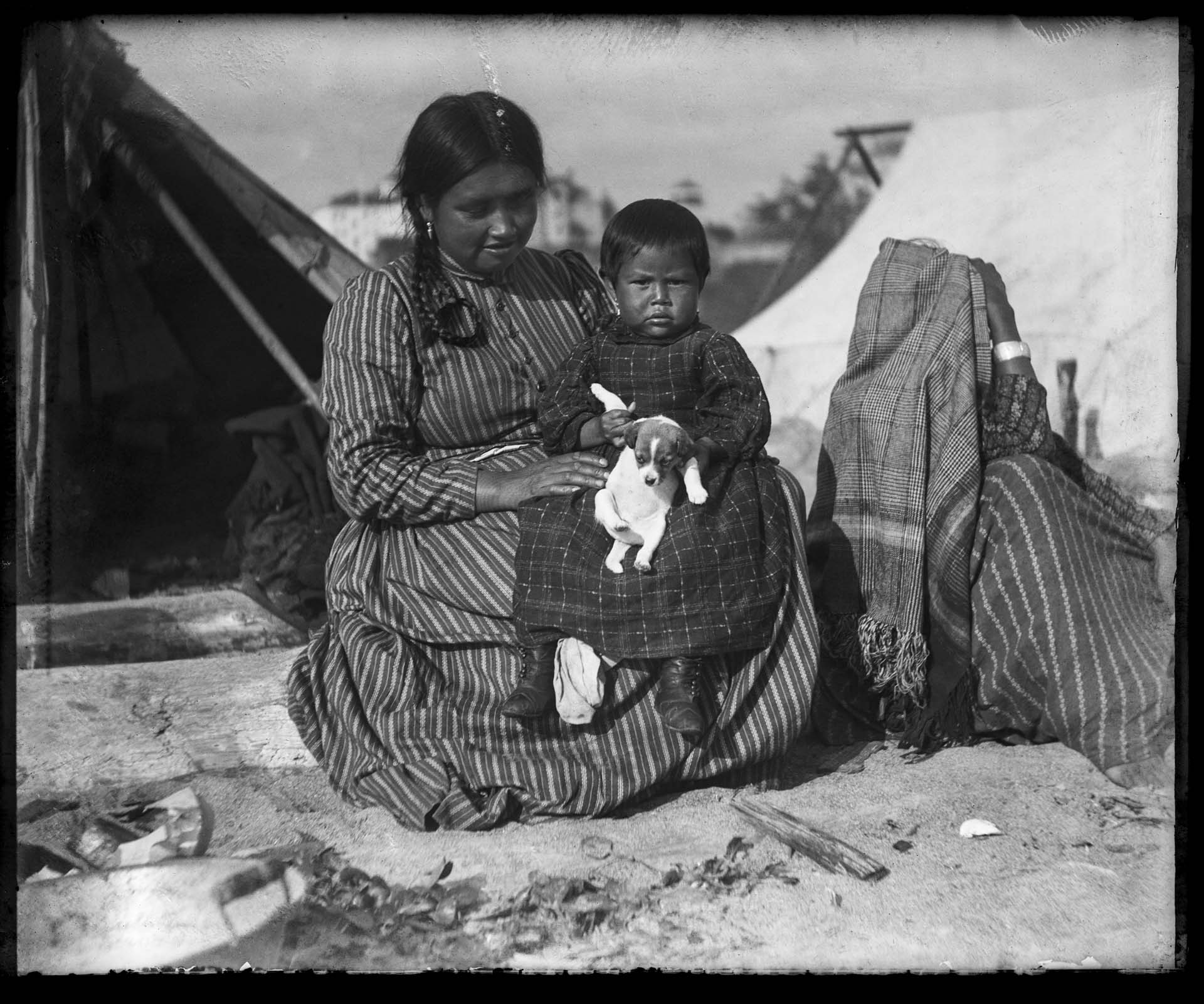 Image of Makah woman and child with puppy, Port Townsend, circa 1900