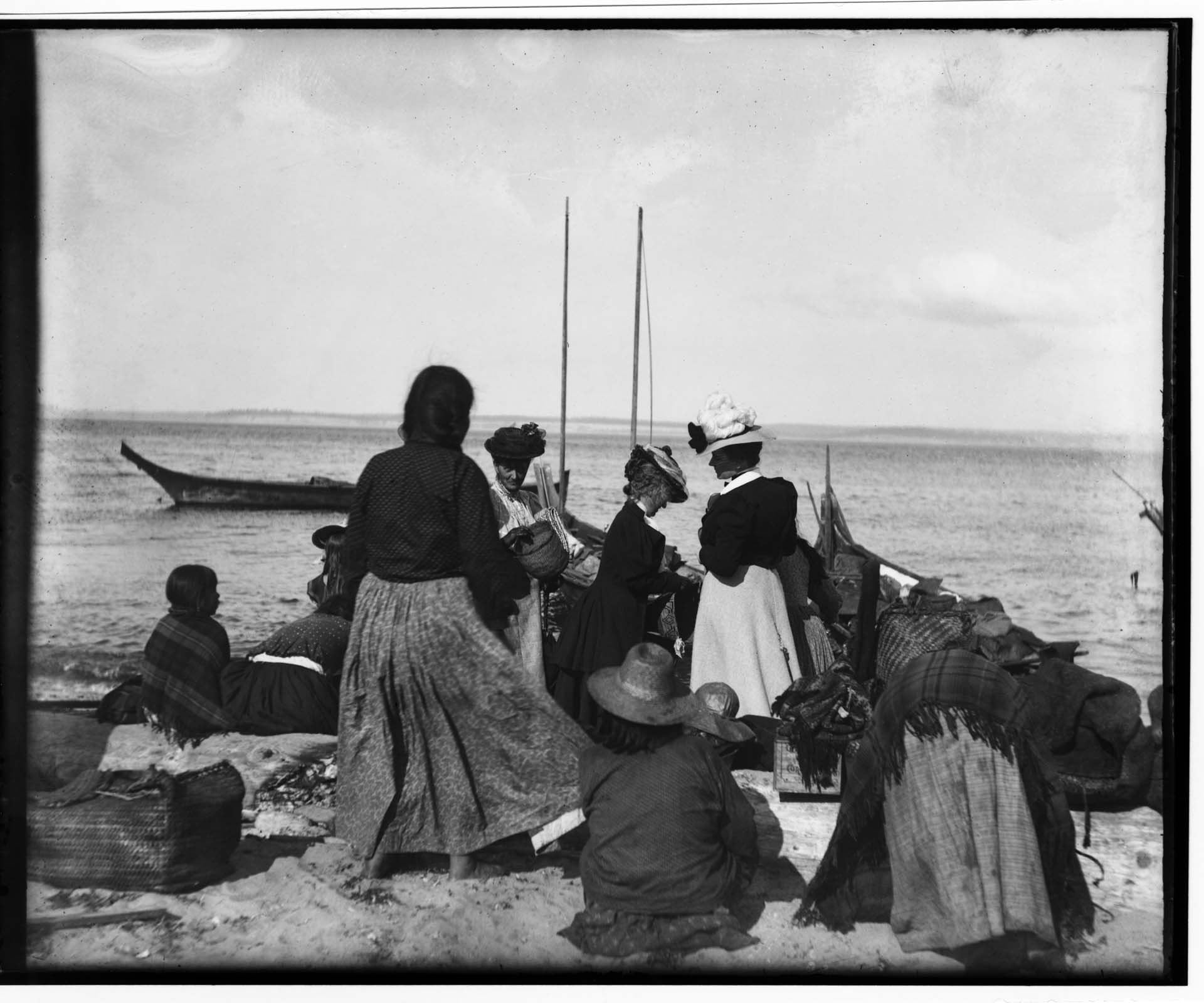 Image of Women shopping for baskets on the beach, Port Townsend, circa 1895